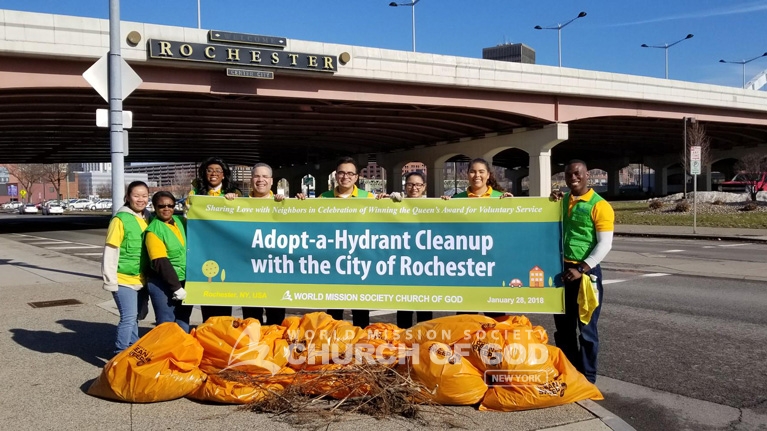 Alt text: World Mission Society Church of God, Wmscog, adopt a hydrant, Rochester, ny, New York, cleanup, volunteers, volunteerism, Christian, environmental preservation, fire fighters, city, urban