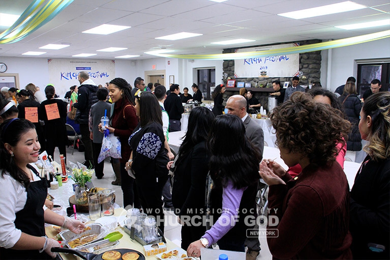 People enjoying international cuisine at the Hudson Valley Kimchi Festival in New Windsor.